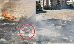Alevlere rağmen salça karıştırmaya devam etti