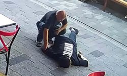 Fenalaşıp yere yığılan gencin cebindeki parayı çaldı