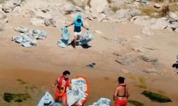 Şile'de günübirlik tatilcilerin bıraktığı çöpler jet ski ve kanolarla kıyıya taşındı