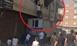 Yangında mahsur kalan kadını konteynerin üzerine çıkarak kurtardılar