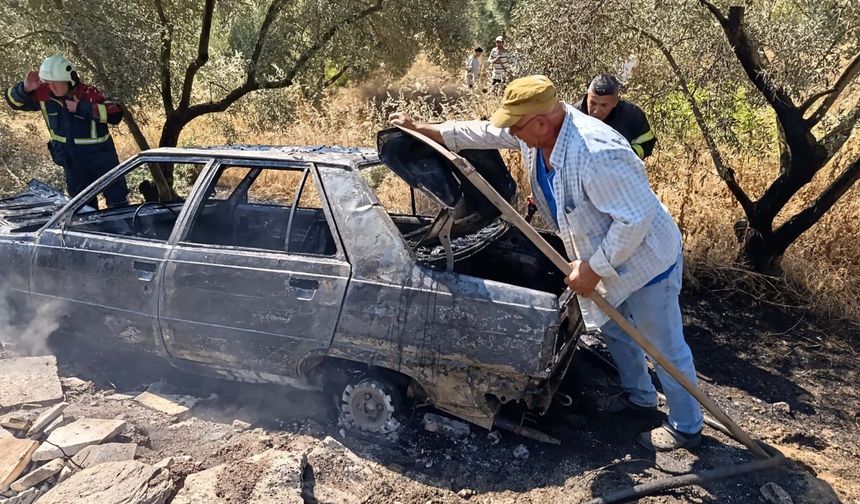 Yanan otomobilini uzaklaştırıp, alevlerin ormana sıçramasını önledi