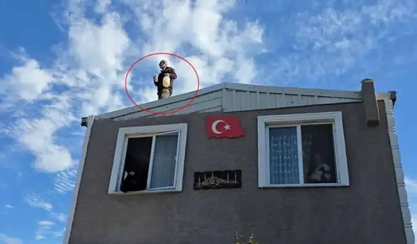 Kaçak evinin yıkımına engel olmak için benzin bidonuyla çatıya çıktı